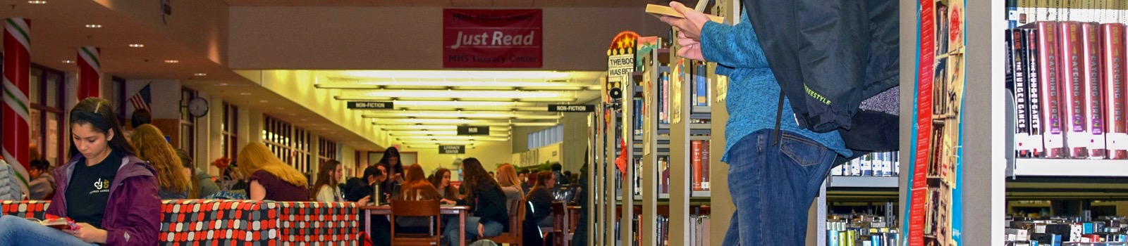 students reading in media center