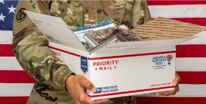 Photo of military accepting boxes of goods