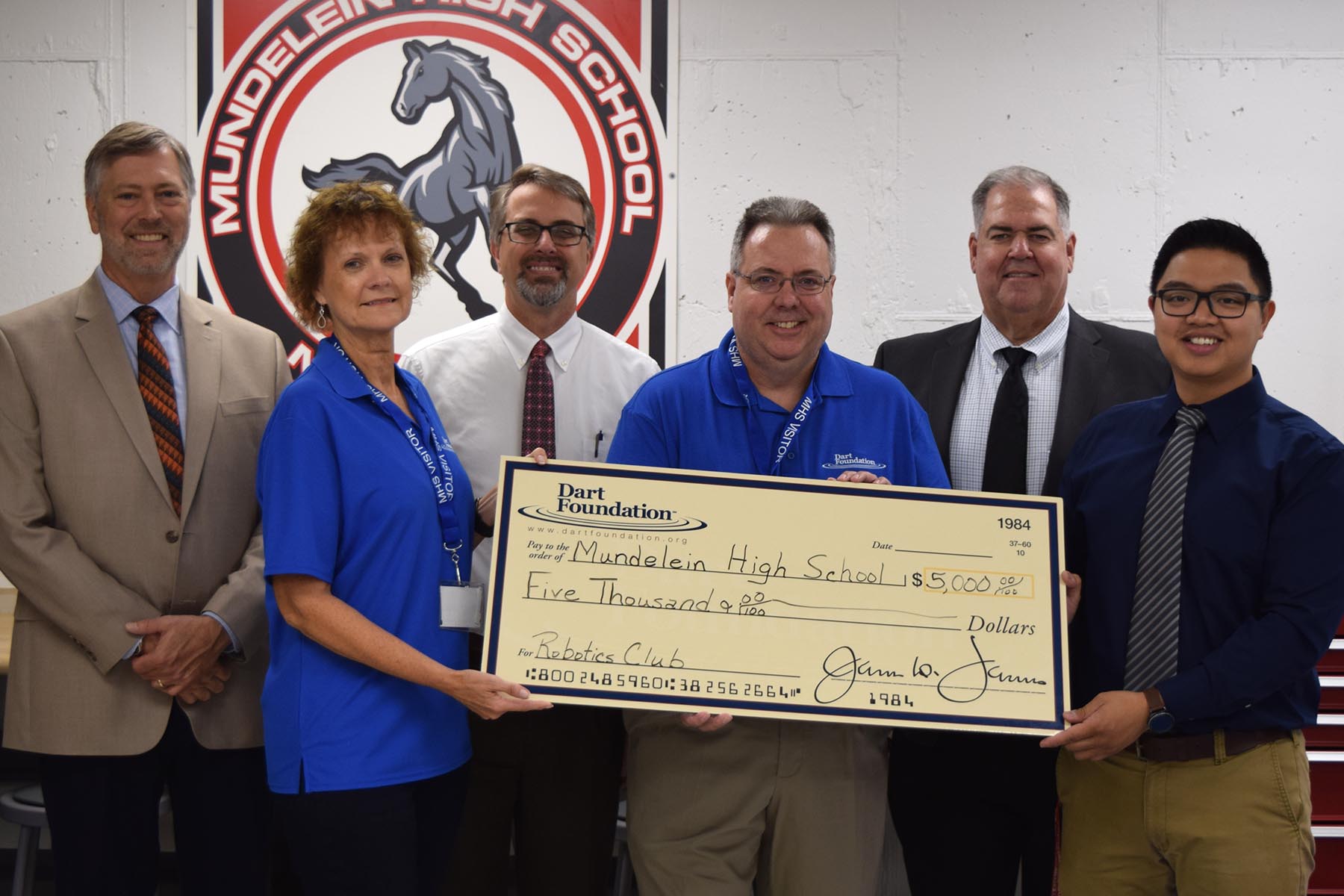 Group pic including Manny Aldana; Andy Searle, chief school business official; Anthony Kroll, MHS Principal; Larry Calhoun, fine and applied arts department chair; John McInerney and Cheryl Nesterowicz of the Dart Foundation
