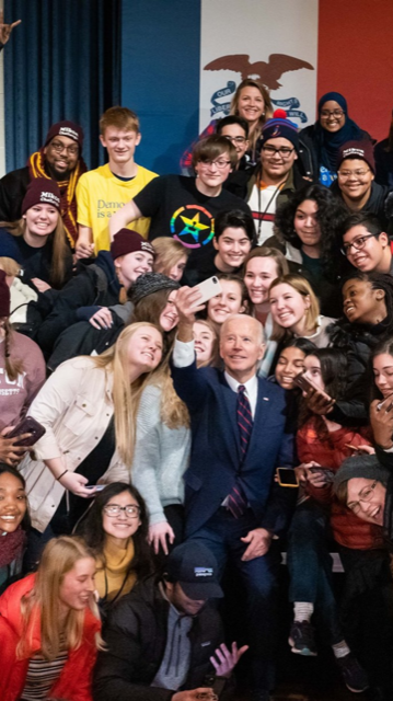 Ilya Vynnyk in a group photo in Iowa with Presidential Candidate Joe Biden