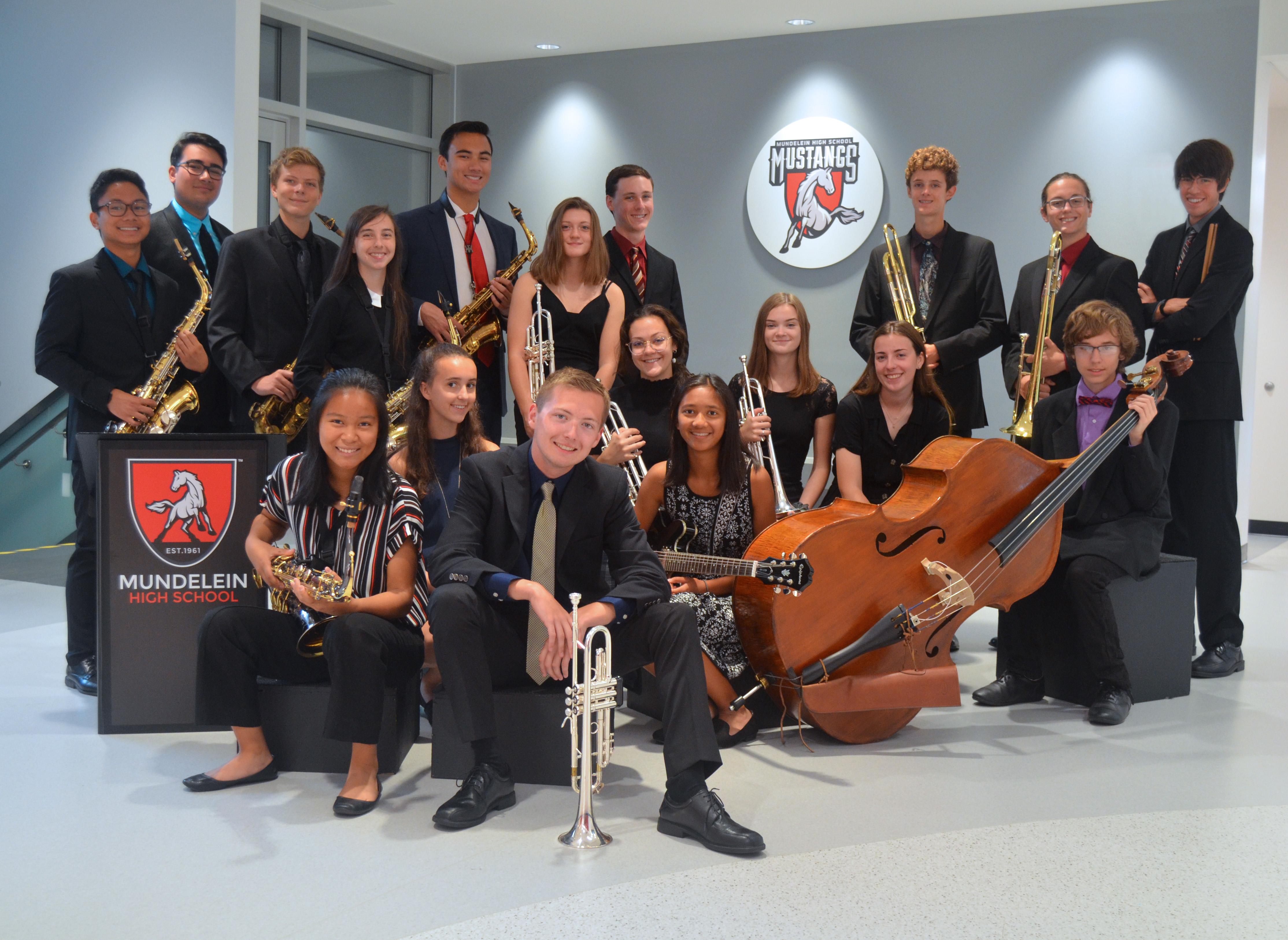 Group photo of Jazz Ensemble members sitting staggered on staircase