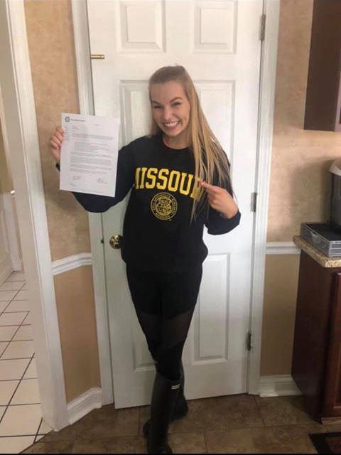 Kimberly Barr holding her acceptance letter.