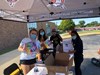 Yearbook staff members distributing yearbooks last summer