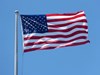 Image of an American flag blowing in the breeze