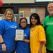 Photo of the student, parents and art teacher
