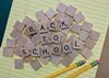 Scrabble pieces that form the words Back to School