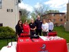 School personnel from D75 and D120 prepare to give "gifts" to students