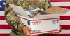 Photo of military accepting boxes of goods