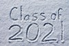 Class of 2021 written in the sand