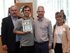 Cole with his parents and supervisor