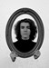 Matthew Callas as Elephant Man looking into a mirror with blank expression