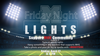 Football stadium lit up with lights and information