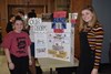 Students standing in front of their display