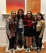 Four members of the team pose for a photo