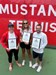 Three Ring of Honor winners pose on the tennis courts
