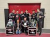 Team members posing with their trophy