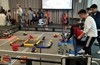 Students working with their robots in a competition