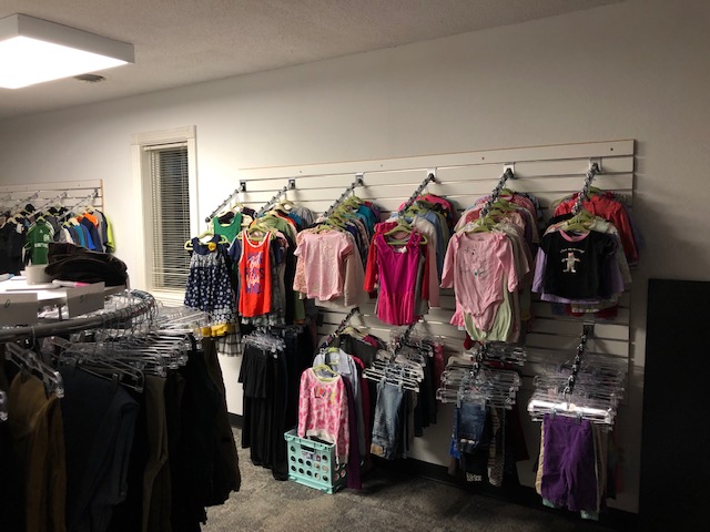 Rack of colorful clothing in the new location