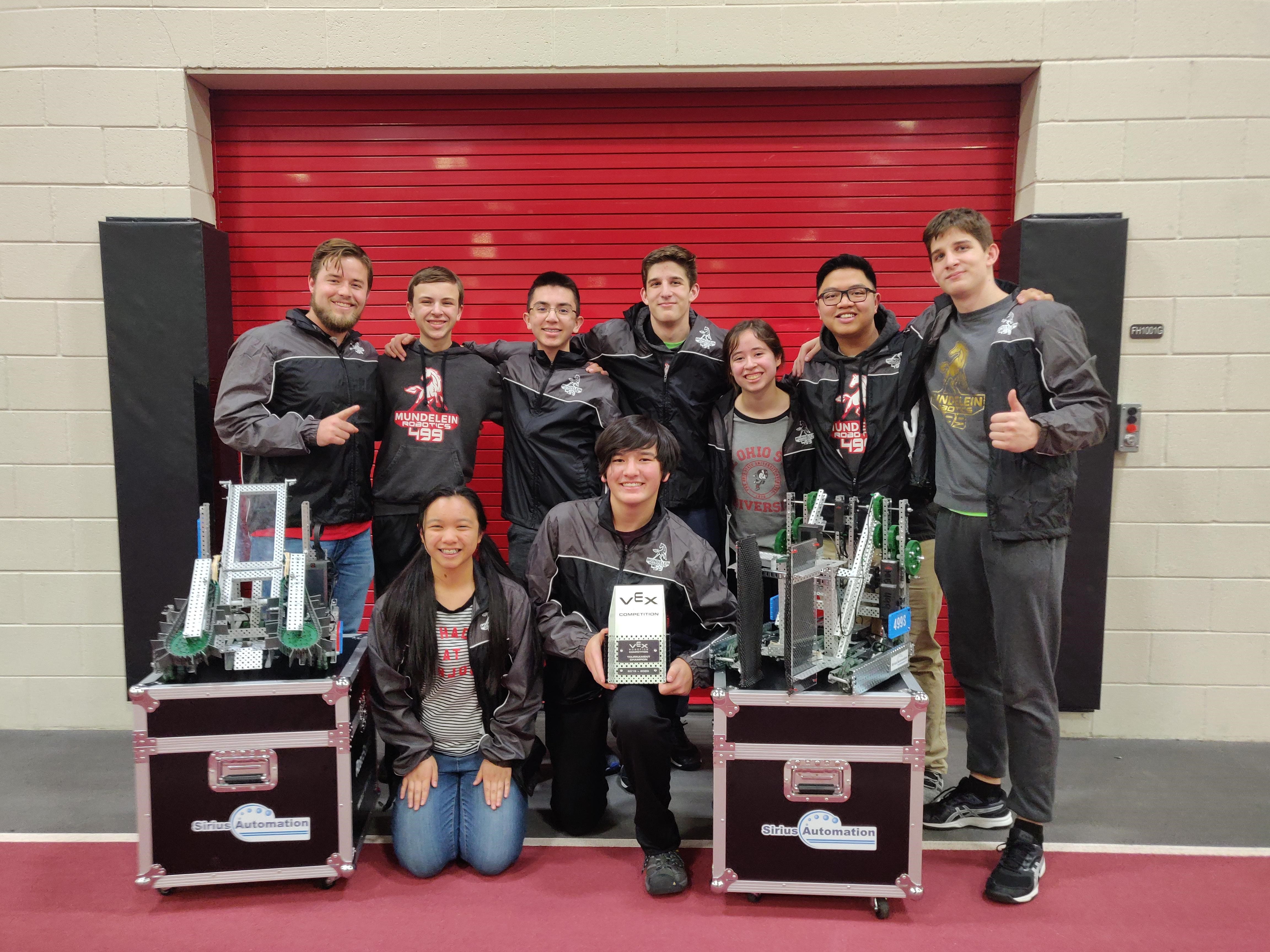Team members posing with their trophy