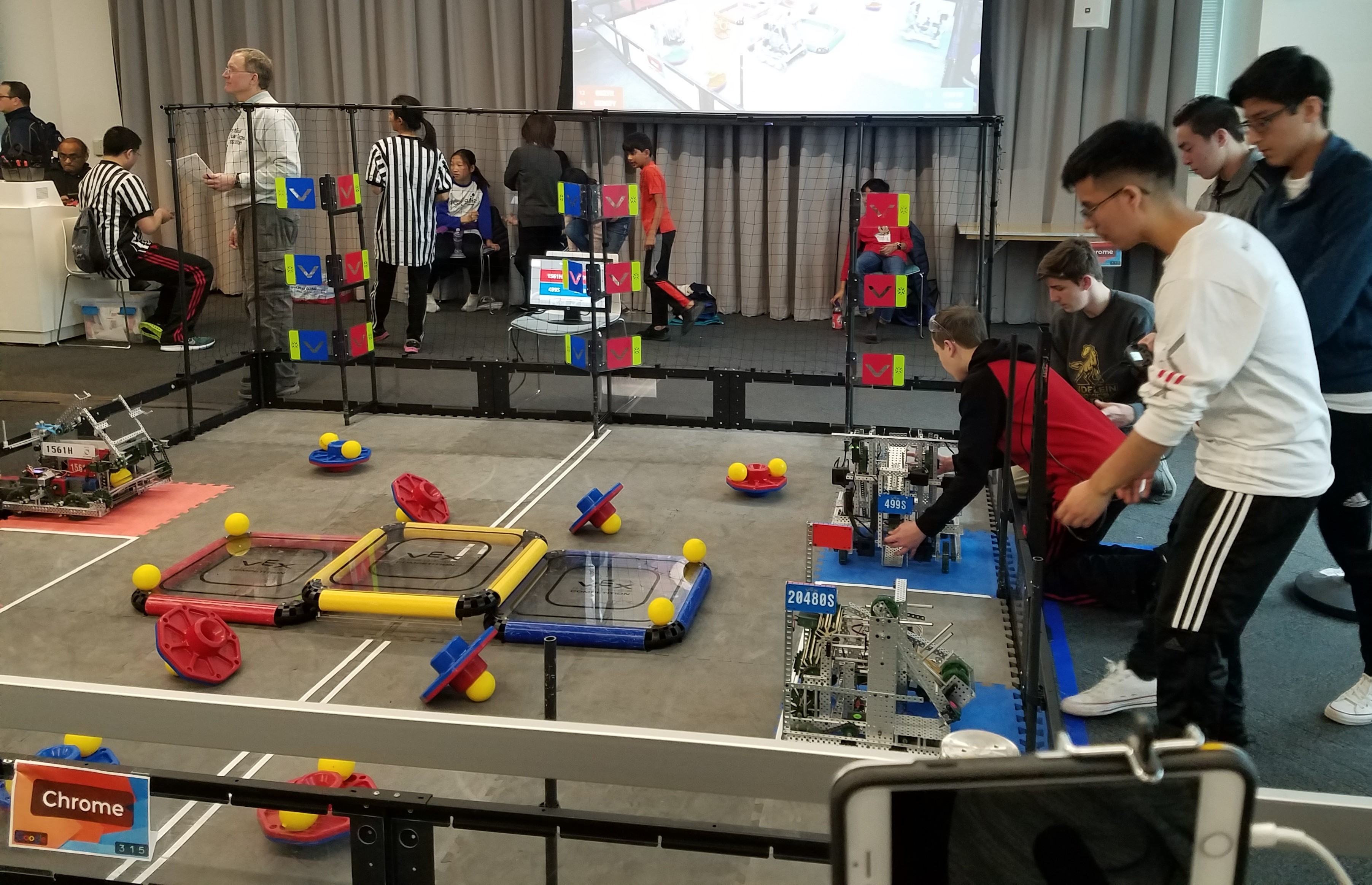 Students working with their robots in a competition