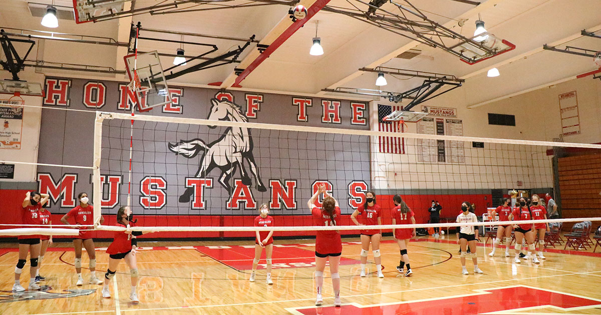 The girls Volleyball team competes in the MHS gym