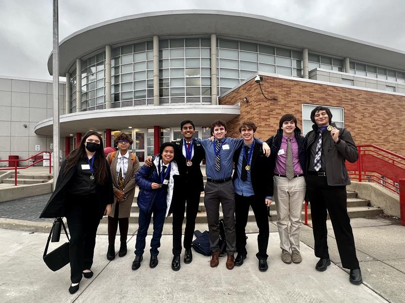 FBLA team shows off medals in front of the high school