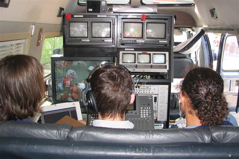 students inside tv van