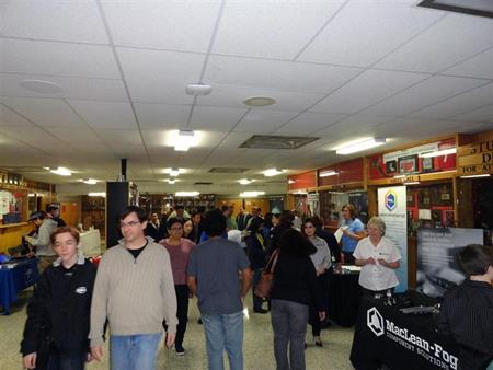 parents and students visiting booths at automation night